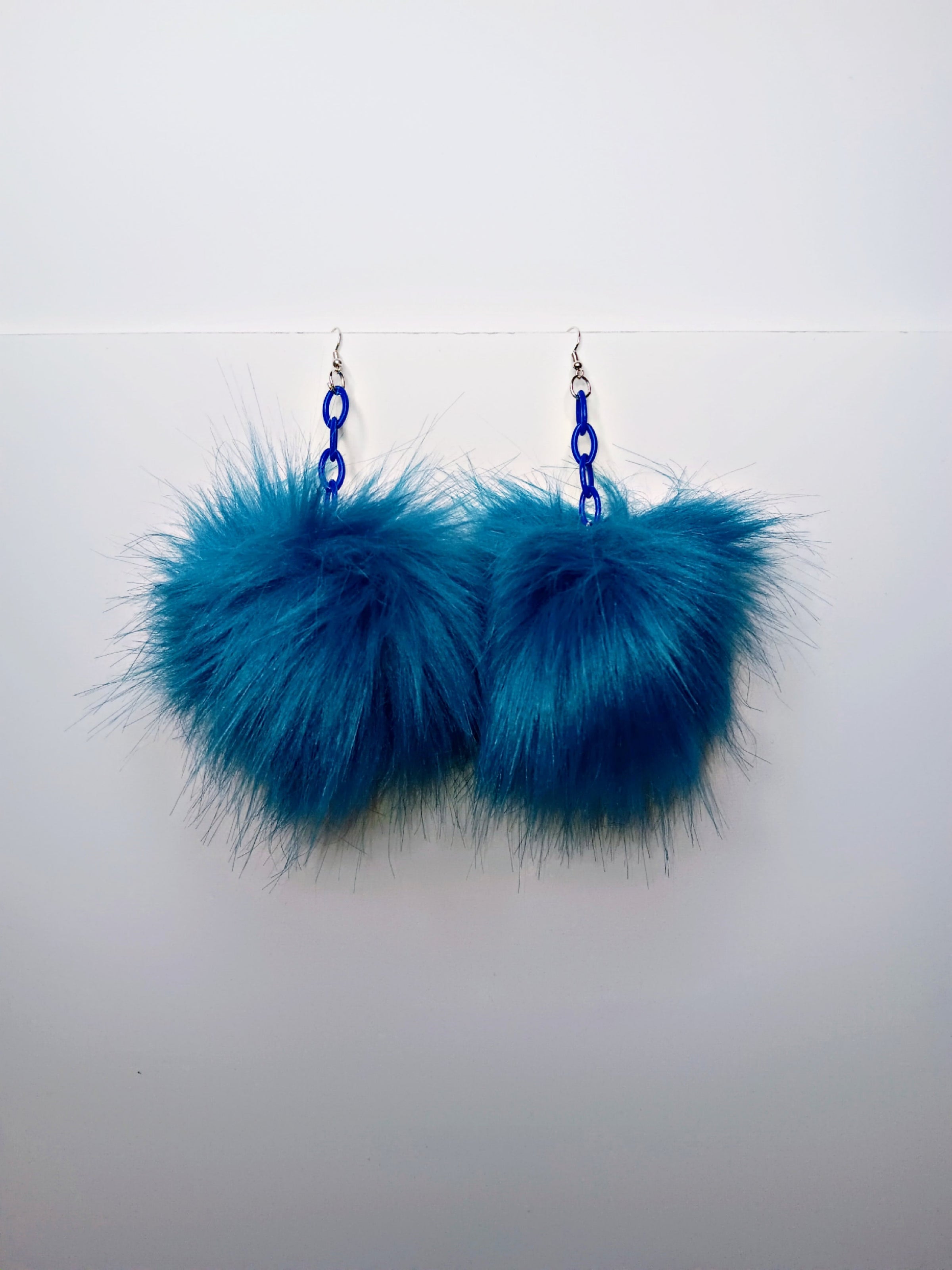 Blue pom shop pom earrings